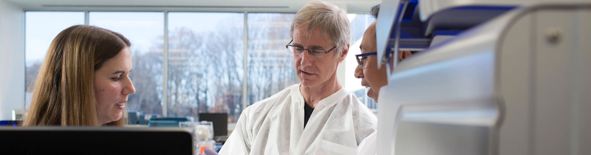 homas Parsons examines the GeneReader NGS System at QIAGEN's laboratory in Germantown